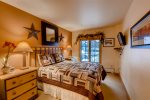 Bedroom 1 features a queen bed